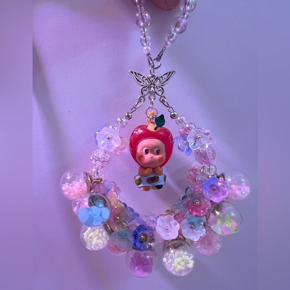 🎁Luminous flower ball with Cute Doll Pendant